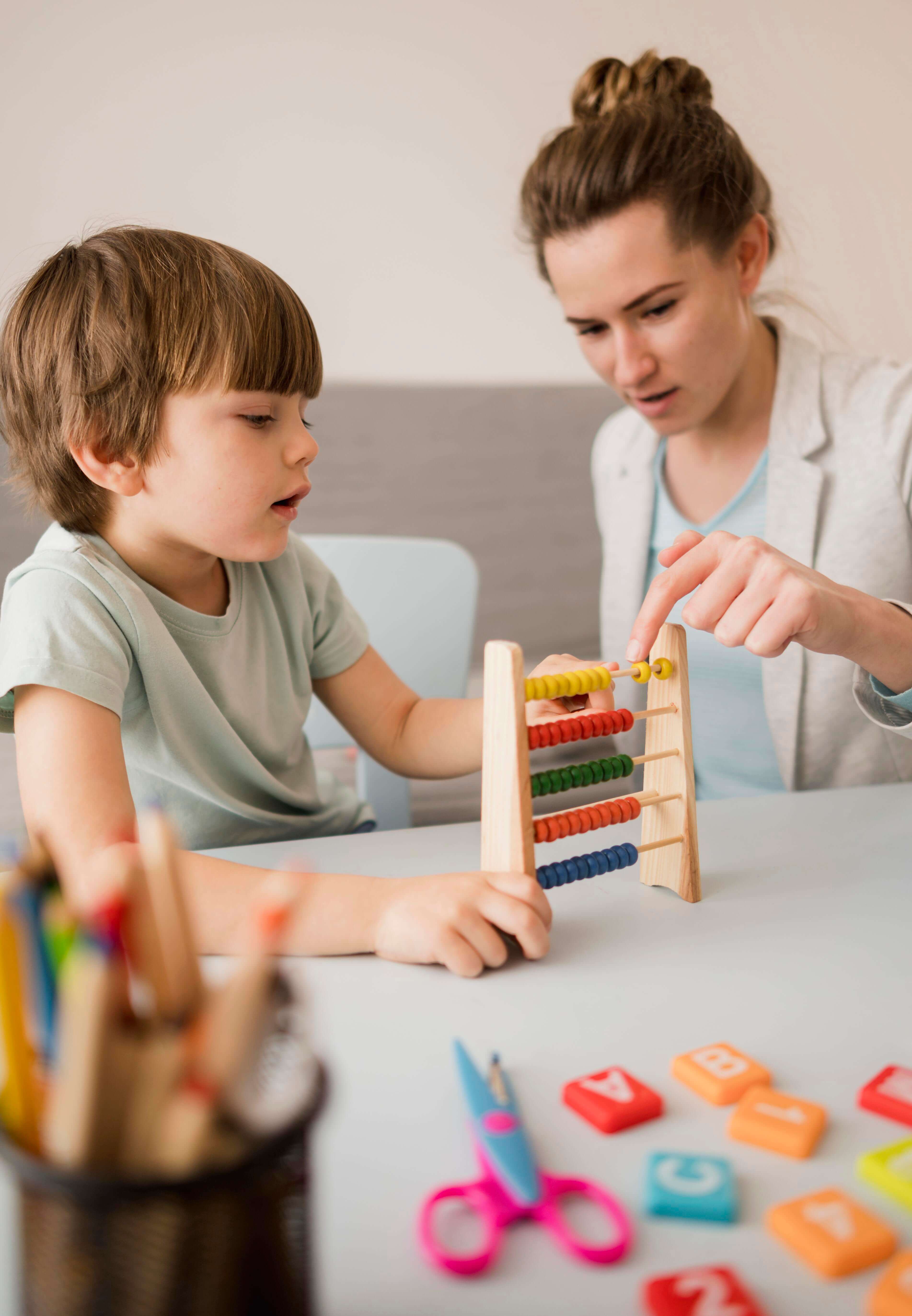 woman helping count to kid